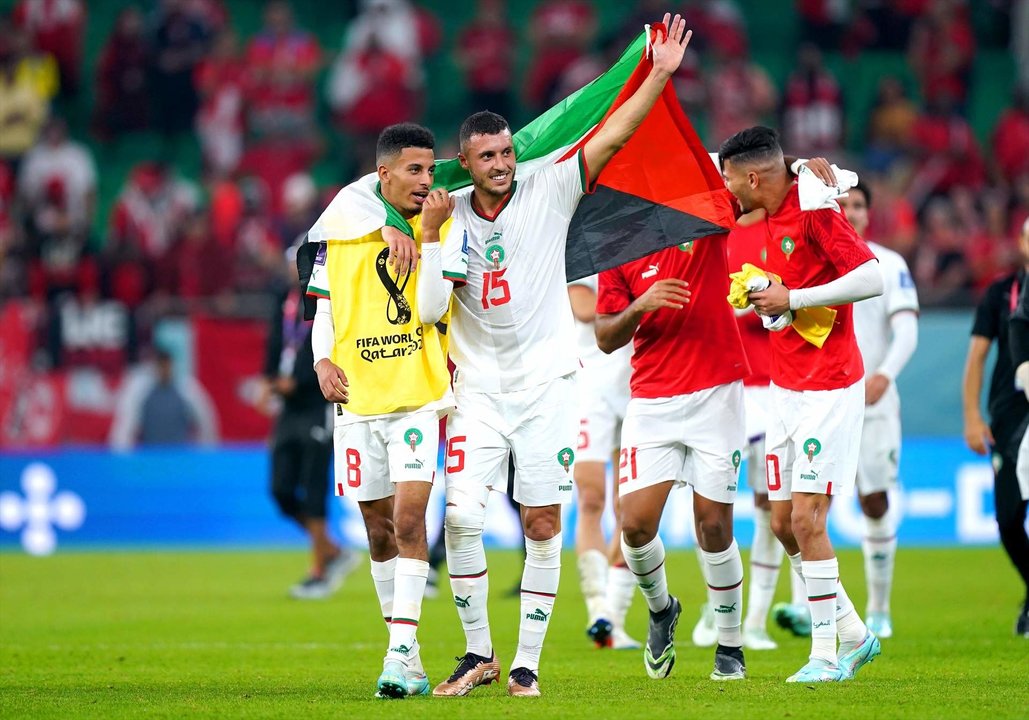 01 December 2022, Qatar, Doha: Morocco's Azzedine Ounahi (L) and Selim Amallah celebrate at the end of the FIFA World Cup Qatar 2022 Group F soccer match between Canada and Morocco at Al Thumama Stadium. Photo: Mike Egerton/PA Wire/dpa